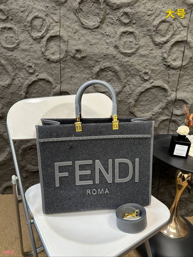 Fendi woolen mini tote bag of the same price, printed with brown ff jacquard pattern and light brown leather Fendi Roma logo, with hard leather handle. Featuring spacious interior compartments with light brown leather edges and gold accents: